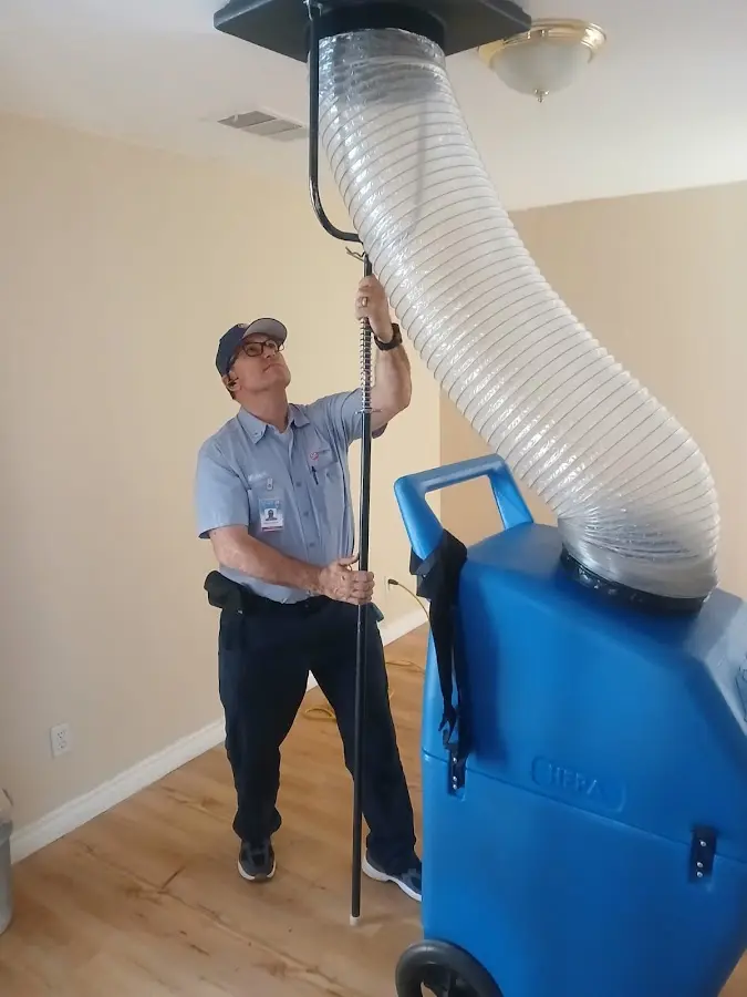 Mini Split Installation technician using HEPA equipment in Country Club Estates